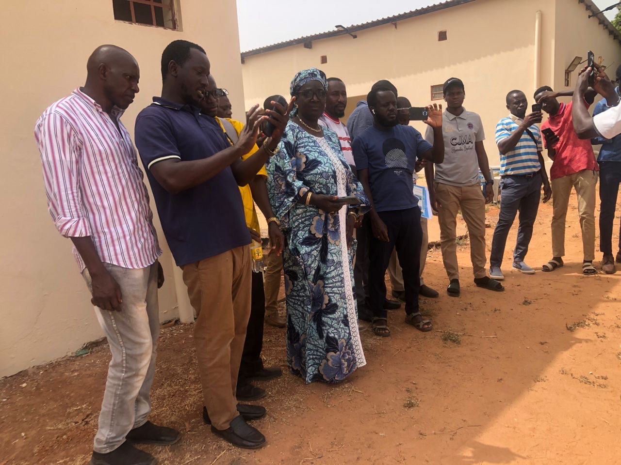 Group outside taking photos.